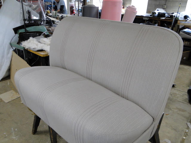 Bar stool or commercial seating with brown upholstery